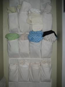 Over-the-door canvas shoe organizerturned into diaper storage